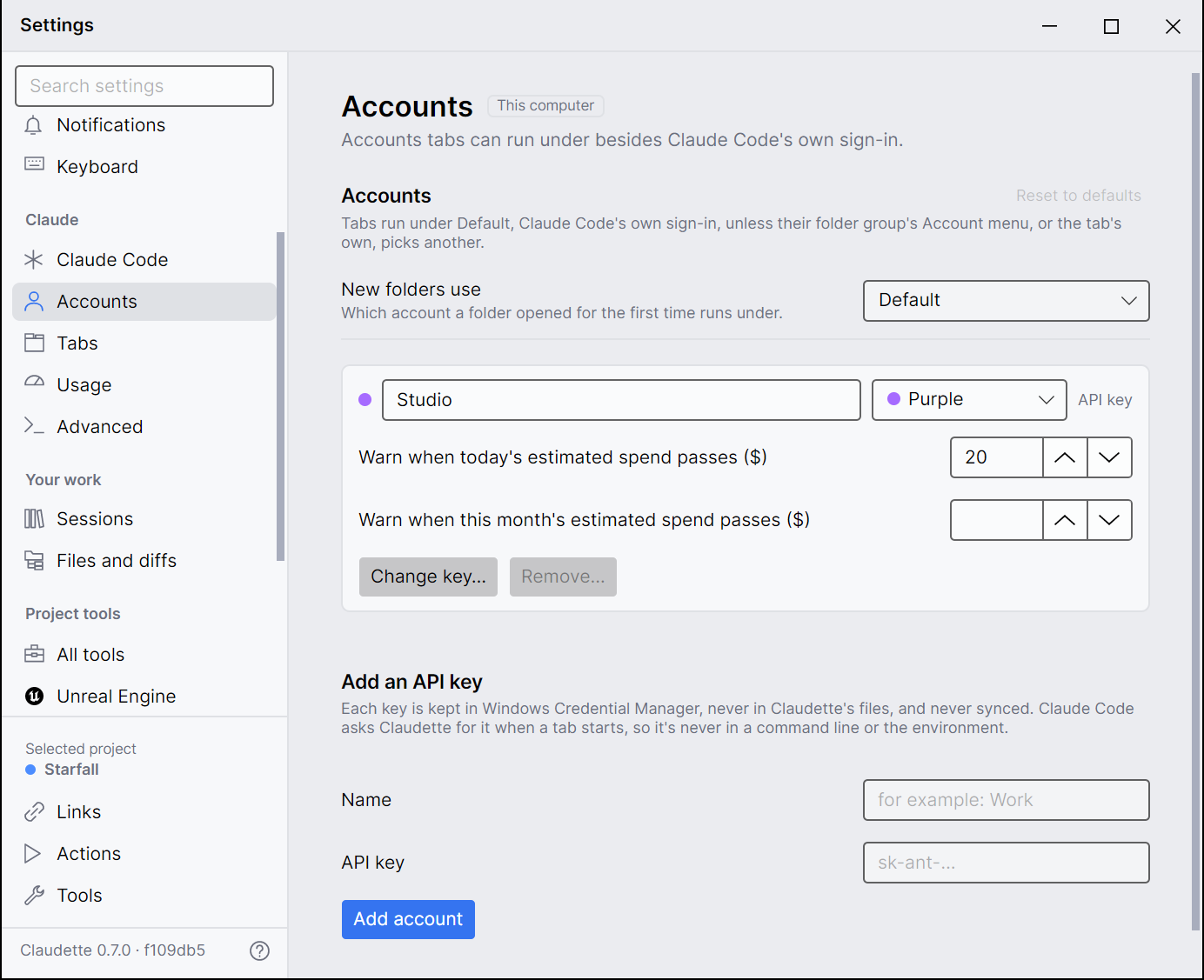 Settings → Accounts with an account named Studio: its name and tag color, its two spend warnings, Change key and Remove, and the form for adding another key